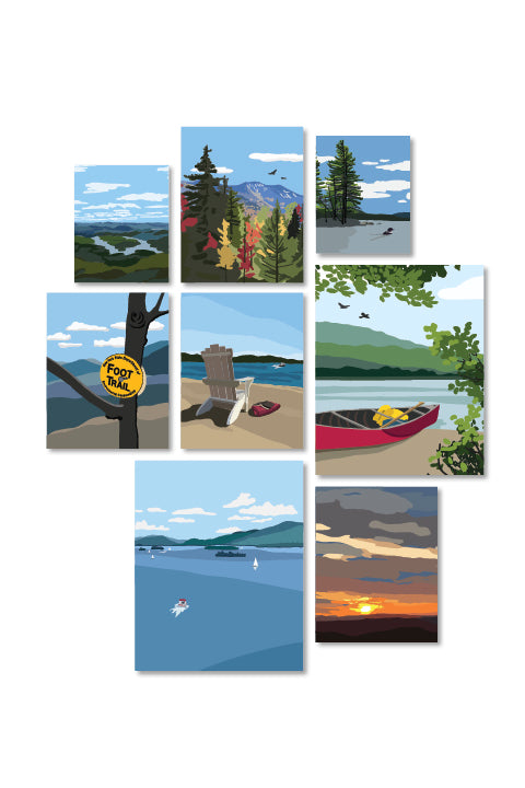 Set of eight illustrated Adirondack themed art prints featuring various outdoor scenes including a canoe on a lake, an Adirondack chair on a beach, a high peaks image in fall, lake placid from the top of whiteface, a foot trail marker on a tree, a sunset and two lake prints, one with a loon and one of lake George.