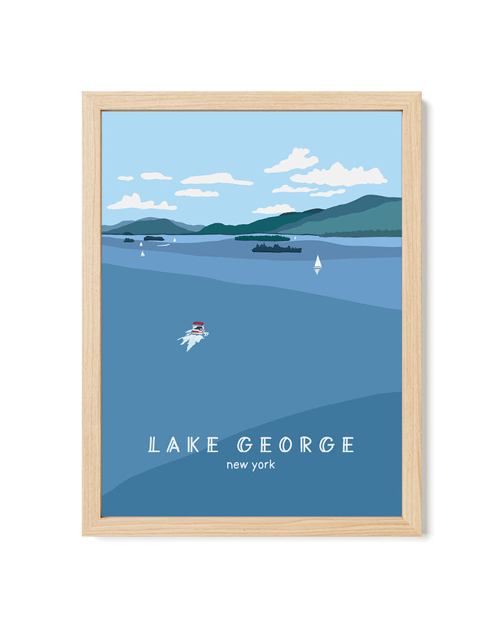 Framed artwork of Lake George, New York with boats on the water and blue sky and mountains.