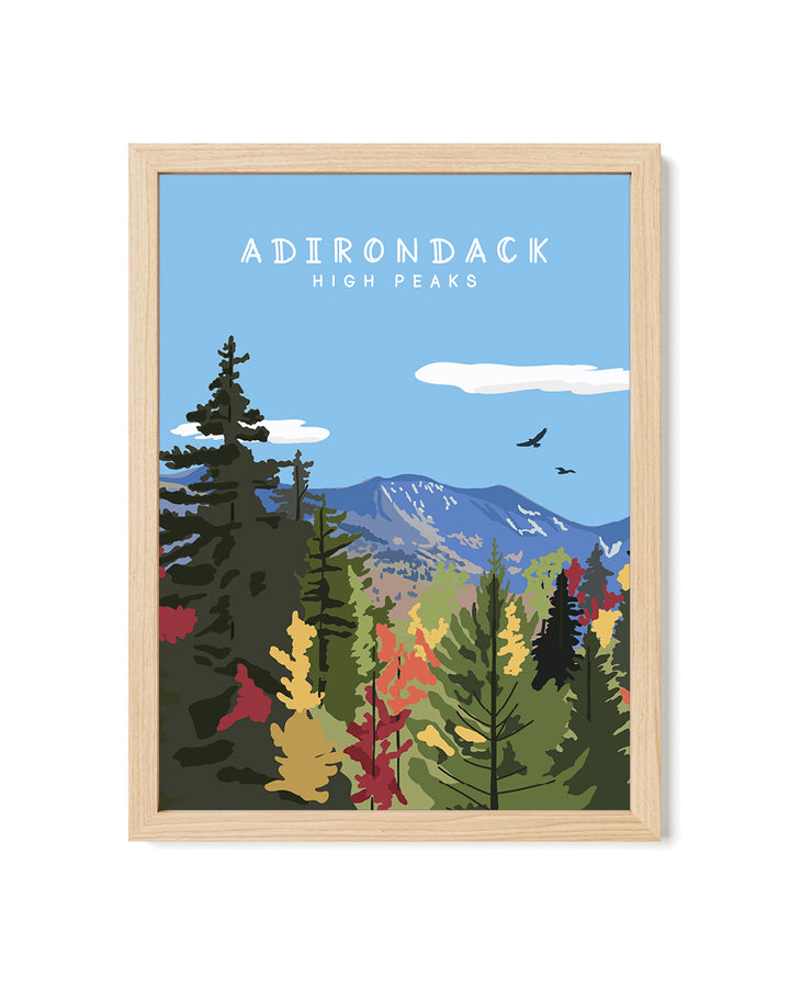 Framed artwork of a forest scene with mountains and &