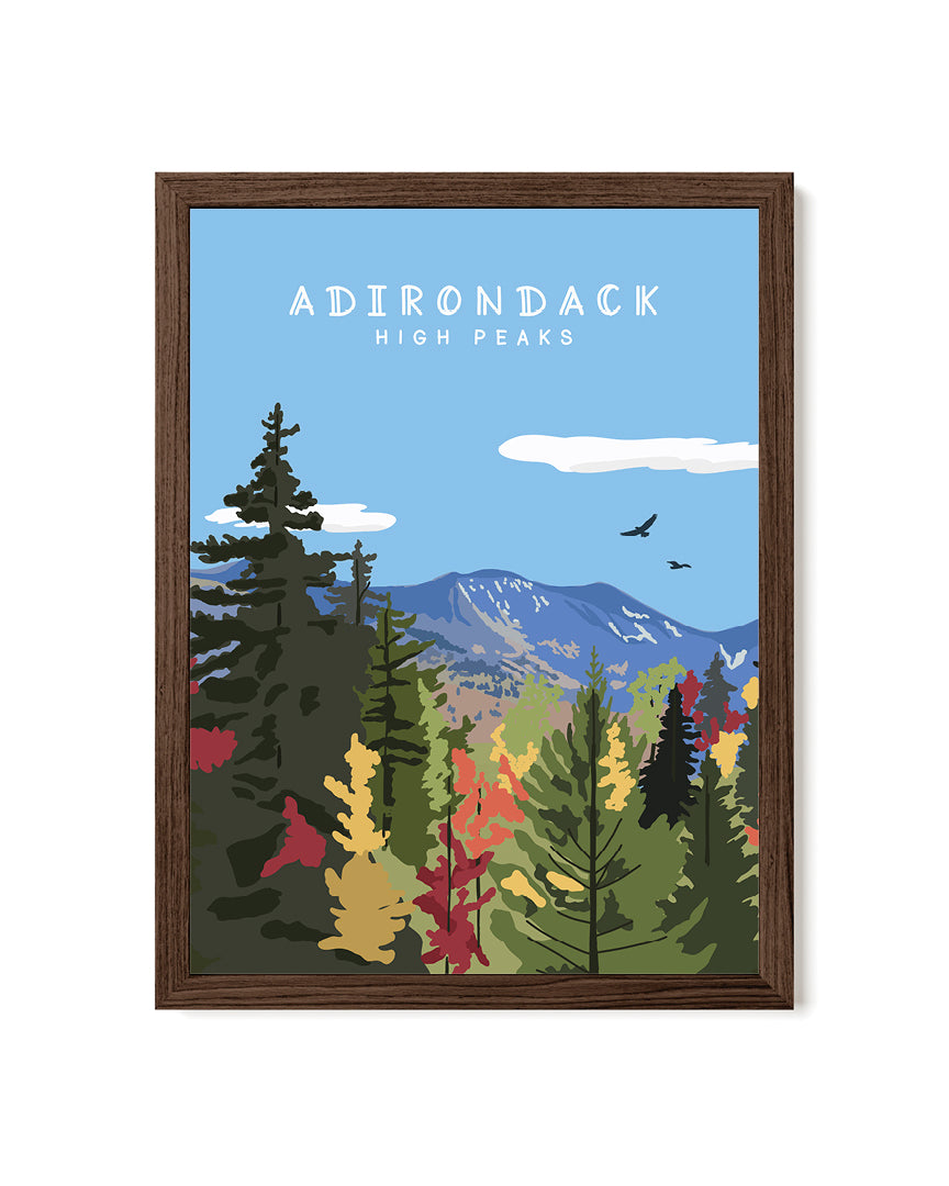 Framed artwork of a forest scene with mountains and &