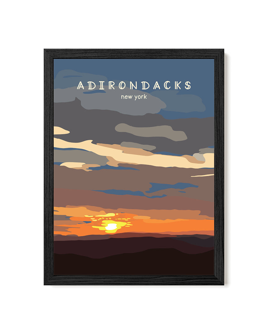Framed artwork of a sunset over mountains with 'Adirondacks, New York' text.