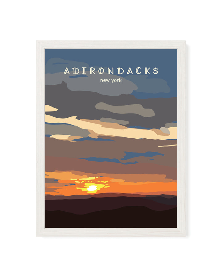 Framed artwork of the Adirondacks with a sunset design.