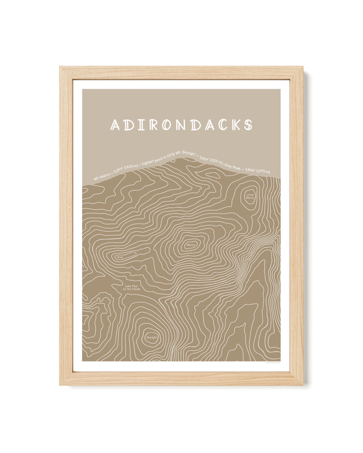 Framed topographic map print in tan of the Adirondacks with a brown frame on a white background