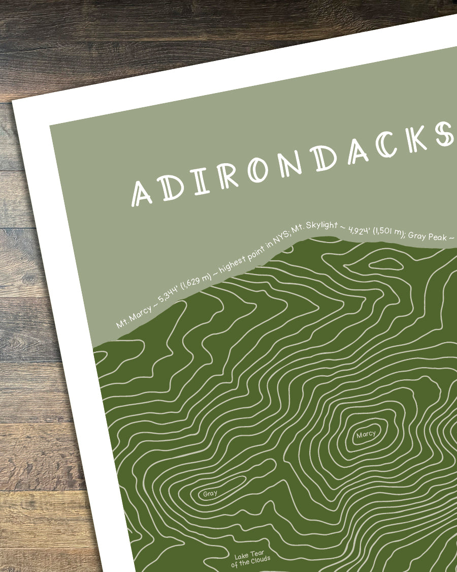Cropped version of the Topographic map of the Adirondacks on a wooden surface
