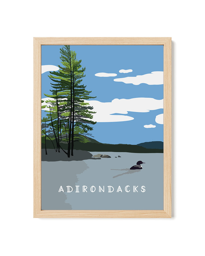 Framed artwork of a lake scene with trees and &