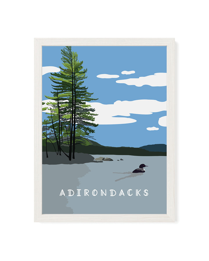 Framed artwork of a lake scene with trees and &