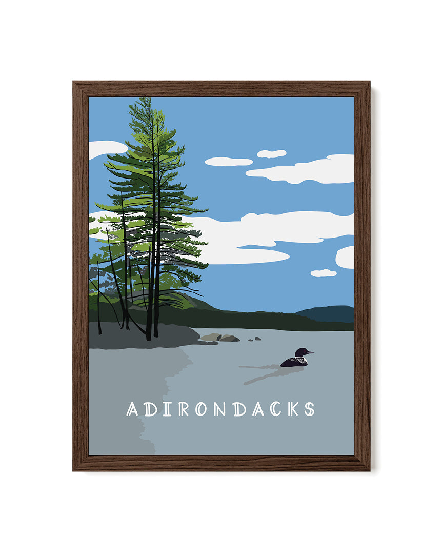 Framed artwork of a lake scene with trees and &