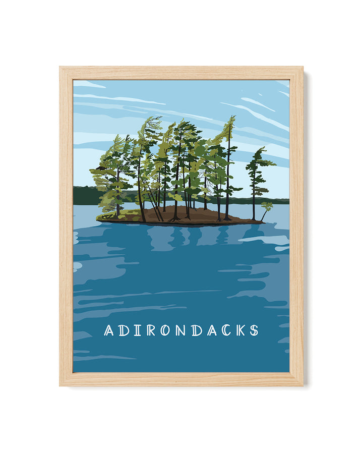 Framed artwork of a lake scene with trees and &