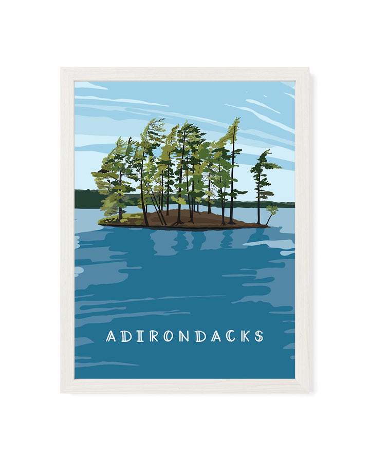 Framed artwork of a lake scene with trees and &