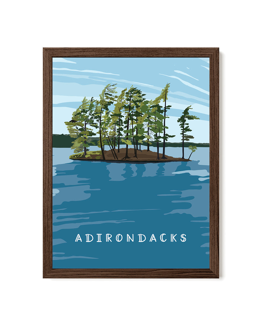 Framed artwork of a lake scene with trees and &