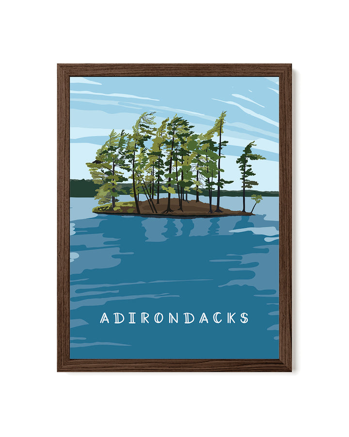 Framed artwork of a lake scene with trees and &